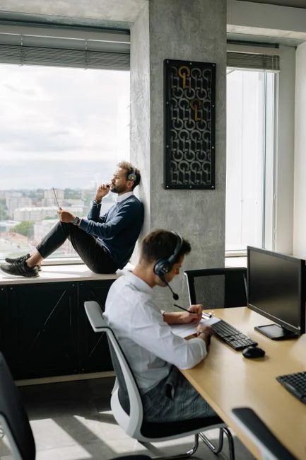 A desktop setup with social media marketing essentials including a keyboard, lightbox, and guide.